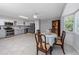 Open kitchen with dining area, stainless steel appliances, and plenty of natural light at 2229 Americus W Blvd # 25, Clearwater, FL 33763