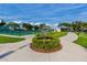 Well-manicured park with sculpture, green space, and tennis courts in background at 2229 Americus W Blvd # 25, Clearwater, FL 33763