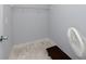 An empty walk-in closet space with installed shelving and tile flooring at 2229 Americus W Blvd # 25, Clearwater, FL 33763