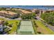Tennis court and surrounding buildings, viewed aerially at 2700 Bayshore Blvd # 532, Dunedin, FL 34698