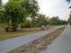 A paved bikeway with two people riding bikes on a sunny day at 2700 Bayshore Blvd # 532, Dunedin, FL 34698