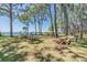 A charming common area and picnic ground with benches, tables, and mature trees at 2700 Bayshore Blvd # 532, Dunedin, FL 34698
