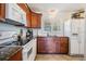 Bright kitchen featuring granite counters, a stainless steel faucet, and modern appliances at 2700 Bayshore Blvd # 532, Dunedin, FL 34698