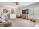 Spacious living area with a sleeper sofa, bright windows and modern accents at 2700 Bayshore Blvd # 532, Dunedin, FL 34698