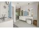 Spacious bathroom with dual vanities, glass shower, and modern fixtures for a luxurious feel at 311 Spring Ave, Anna Maria, FL 34216
