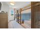 Cozy bunk room with custom wood-framed bunk beds and ample natural light at 311 Spring Ave, Anna Maria, FL 34216