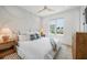 Serene bedroom with natural light, neutral tones, and decorative wall accents at 311 Spring Ave, Anna Maria, FL 34216
