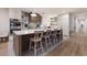 Spacious kitchen island featuring modern appliances, white cabinetry, and stylish backsplash at 311 Spring Ave, Anna Maria, FL 34216