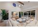 Inviting living room with a large sectional, stylish decor, and natural light at 311 Spring Ave, Anna Maria, FL 34216