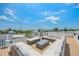 Spacious roof deck with plush seating, perfect for entertaining or relaxing with a view at 311 Spring Ave, Anna Maria, FL 34216