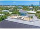 Aerial view of a rooftop deck with comfortable seating and ocean views at 311 Spring Ave, Anna Maria, FL 34216