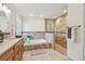 Bathroom showcasing double vanity, soaking tub, and glass shower for a luxurious feel at 3398 Pinnacle S Ct, Palm Harbor, FL 34684