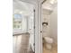 En-suite bathroom featuring tile floors, cabinet, and toilet at 3398 Pinnacle S Ct, Palm Harbor, FL 34684