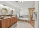 Luxurious bathroom with double vanity, soaking tub, and separate tiled shower at 3398 Pinnacle S Ct, Palm Harbor, FL 34684