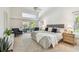 Bright, airy bedroom with high ceilings, patio access, and modern decor at 3398 Pinnacle S Ct, Palm Harbor, FL 34684
