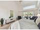 Beautifully decorated bedroom features a serene view of the outdoor pool area at 3398 Pinnacle S Ct, Palm Harbor, FL 34684
