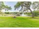 Expansive view of a community park with a gazebo, pier, and water fountain at 3398 Pinnacle S Ct, Palm Harbor, FL 34684