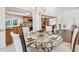 Bright dining area with a glass table that is perfect for entertaining at 3398 Pinnacle S Ct, Palm Harbor, FL 34684