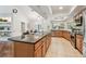 Spacious kitchen with stainless appliances, ample storage in wood cabinets and a large granite counter island at 3398 Pinnacle S Ct, Palm Harbor, FL 34684