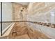 Tiled shower with dual shower heads and glass enclosure for a spa-like experience at 3398 Pinnacle S Ct, Palm Harbor, FL 34684