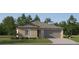 Charming one-story home with a two-car garage, neutral siding, and well-maintained landscaping at 35097 Brackett Bnd, Zephyrhills, FL 33541