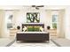 Bright bedroom features a plush bed, and matching nightstands at 35105 Brackett Bnd, Zephyrhills, FL 33541