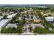 Aerial view of condo community featuring mature trees, a central pool, and easy street access at 4207 S Dale Mabry Hwy # 3302, Tampa, FL 33611