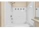 Bright bathroom featuring a tiled shower and tub combination with neutral tones, very clean at 4207 S Dale Mabry Hwy # 3302, Tampa, FL 33611