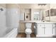 Bathroom featuring tiled shower and tub, vanity with cabinet, and neutral wall color at 4207 S Dale Mabry Hwy # 3302, Tampa, FL 33611