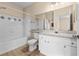 Bathroom featuring tiled shower and tub, vanity with cabinet, and neutral wall color at 4207 S Dale Mabry Hwy # 3302, Tampa, FL 33611