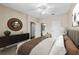 Cozy bedroom with a round mirror, a ceiling fan, and multiple doors leading to other spaces at 4207 S Dale Mabry Hwy # 3302, Tampa, FL 33611