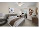 Bright bedroom featuring a ceiling fan, stylish decor, and a functional desk area by the window at 4207 S Dale Mabry Hwy # 3302, Tampa, FL 33611