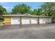 Four-car attached garage with white doors, offering ample parking and storage space at 4207 S Dale Mabry Hwy # 3302, Tampa, FL 33611