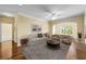 Bright living room with a large arched window, hardwood floors, and cozy neutral-toned furniture at 4207 S Dale Mabry Hwy # 3302, Tampa, FL 33611