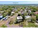 An aerial view of a residential neighborhood featuring tree-lined streets and a home near Downtown St. Pete at 500 Oleander S Way, St Petersburg, FL 33707