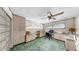Bright bedroom with custom cabinets, built-in desk, and a ceiling fan at 500 Oleander S Way, St Petersburg, FL 33707