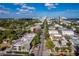 An aerial view of a long street lined with building, palm trees, and leading towards the skyline of St. Petersburg at 500 Oleander S Way, St Petersburg, FL 33707