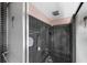 Tiled shower stall features square black tile, pink walls, and dual shower doors at 500 Oleander S Way, St Petersburg, FL 33707
