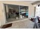 Large sliding glass door offering seamless access to a relaxing outdoor pool area at 500 Oleander S Way, St Petersburg, FL 33707