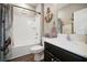 Cozy bathroom featuring a shower-tub combo, nautical decor, and a modern vanity at 5524 Yellowfin Ct, New Port Richey, FL 34652