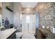 Bathroom features a tiled shower, vanity, and wood look flooring at 5524 Yellowfin Ct, New Port Richey, FL 34652