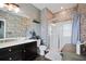 Bathroom features tiled shower, modern vanity, and decorative accents at 5524 Yellowfin Ct, New Port Richey, FL 34652