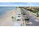 Wide shot showing beach access with picnic shelters and parking along the sandy shoreline at 5524 Yellowfin Ct, New Port Richey, FL 34652