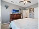 Bedroom with neutral walls, carpet, and TV at 5524 Yellowfin Ct, New Port Richey, FL 34652