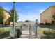 Community dog park with a secure fence, dog waste station, and green space at 5524 Yellowfin Ct, New Port Richey, FL 34652