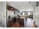Open-concept kitchen featuring stainless steel appliances, island, and connection to the living room at 5524 Yellowfin Ct, New Port Richey, FL 34652