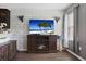 Cozy living room features a fireplace and decorative brick accent wall at 5524 Yellowfin Ct, New Port Richey, FL 34652