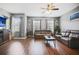 Spacious living room featuring modern furnishings, a ceiling fan, and abundant natural light at 5524 Yellowfin Ct, New Port Richey, FL 34652