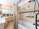 Elegant bathroom features a jacuzzi tub, tile backsplash, and cabinet with sink at 5533 97Th N Way, St Petersburg, FL 33708