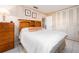 Comfortable bedroom with wooden accents, neutral decor, and ample closet space at 5533 97Th N Way, St Petersburg, FL 33708